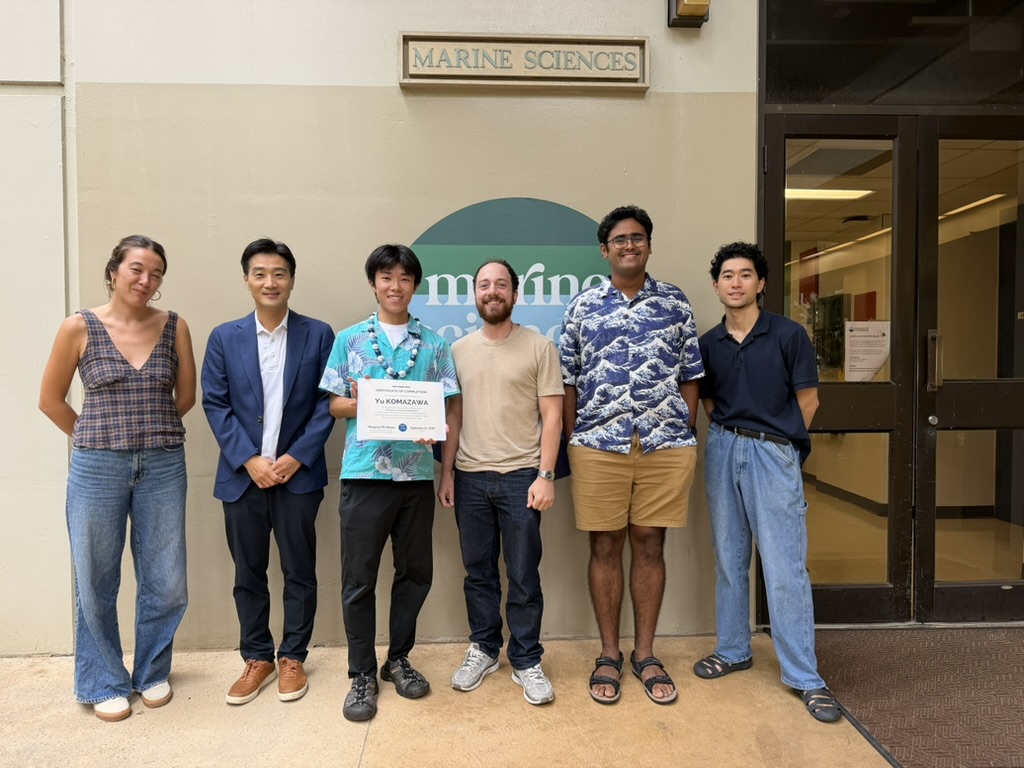 Sid with his postdoc advisor and colleagues outside MSB